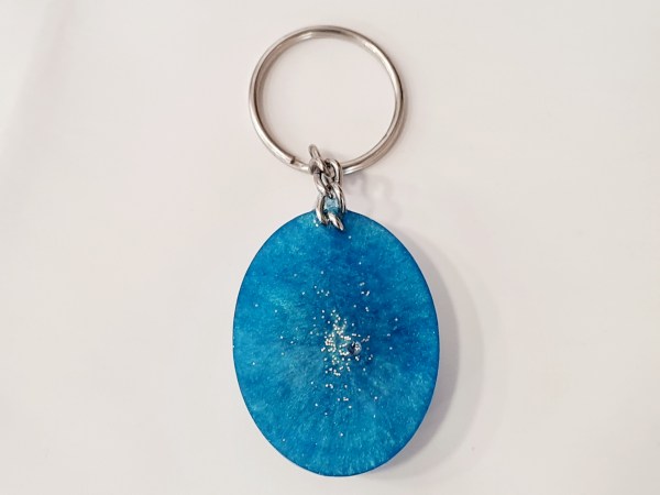 porte clé orgonite oval fleur arbre de vie